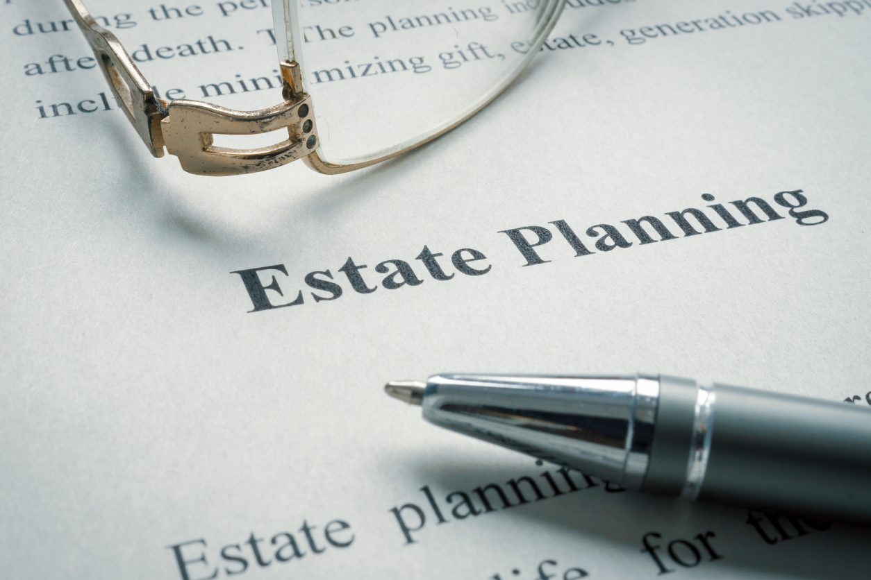 Estate planning document with pen and glasses.